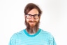 A professional headshot of Jose Ángel Mateos, an IT Engineer, featuring a man with a full beard, dark-rimmed glasses, and brown hair, wearing a turquoise and white horizontally striped t-shirt, set against a clean white background, likely used for the team page of AcumbaMail to showcase company personnel.